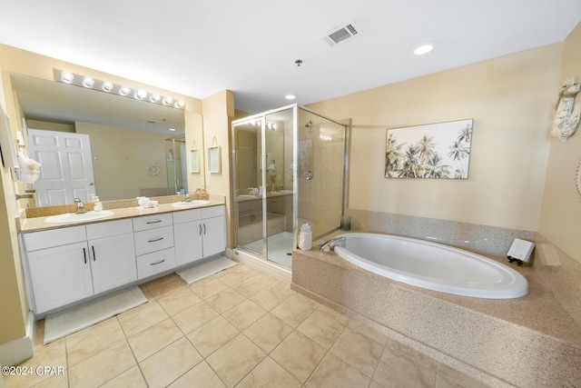 full bathroom featuring a shower stall, double vanity, visible vents, and a sink