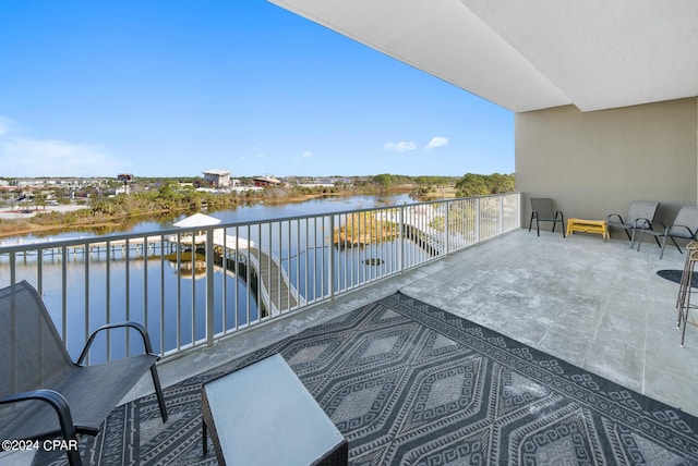 balcony featuring a water view