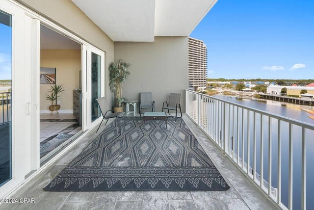 balcony featuring a water view