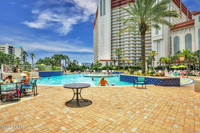 view of swimming pool with a patio area