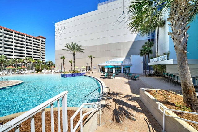 view of pool featuring a patio