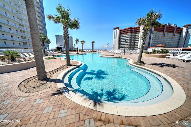 community pool featuring a patio area