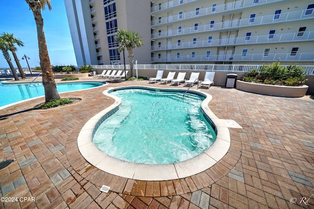 view of swimming pool with a patio