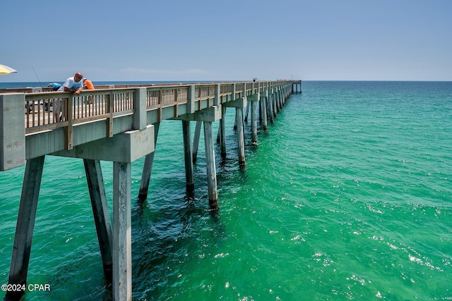 dock area featuring a pier and a water view