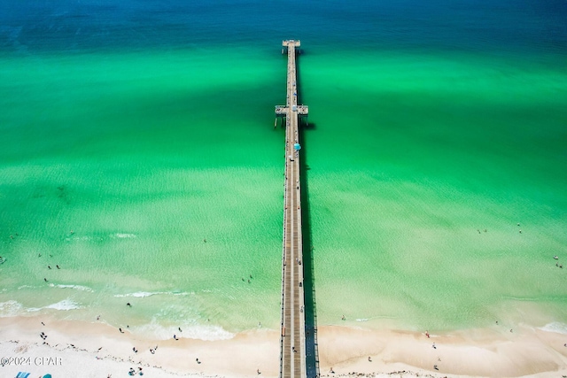 drone / aerial view with a beach view and a water view