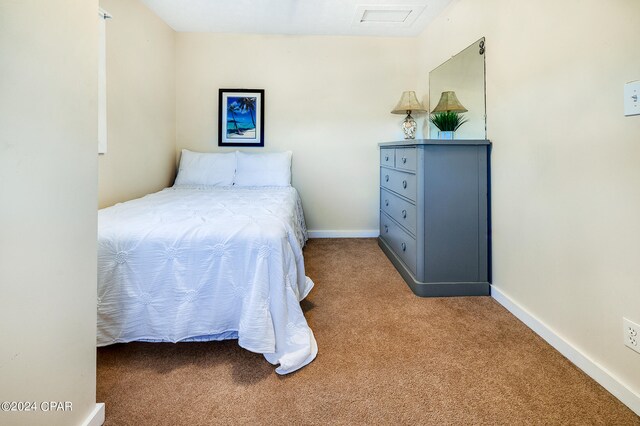 bedroom featuring light colored carpet