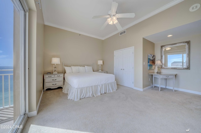 bedroom with visible vents, baseboards, carpet floors, ornamental molding, and a ceiling fan