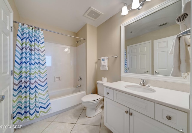 full bath featuring shower / tub combo, visible vents, toilet, vanity, and tile patterned flooring