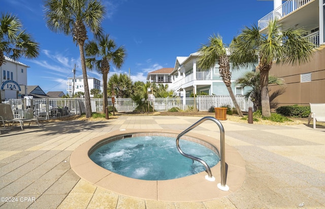 view of swimming pool with a pool, fence, a residential view, and a patio area