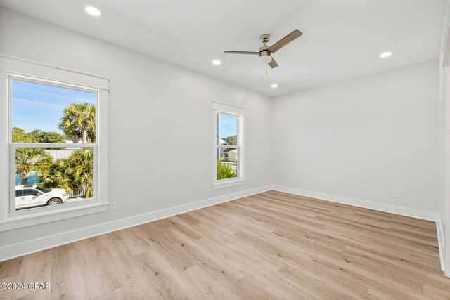 empty room featuring light hardwood / wood-style floors and ceiling fan