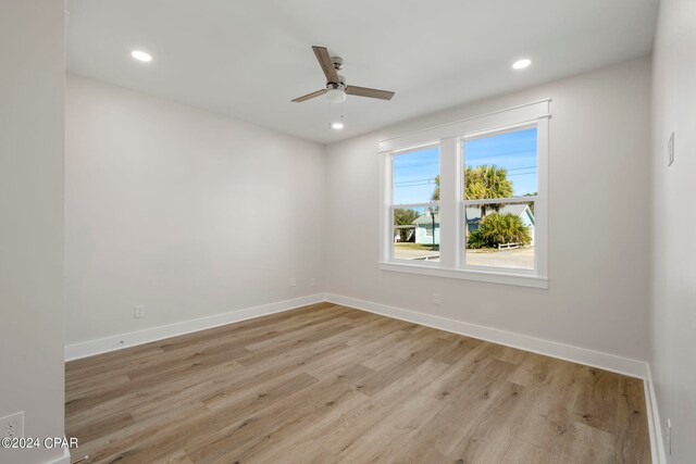 empty room featuring light hardwood / wood-style floors and ceiling fan