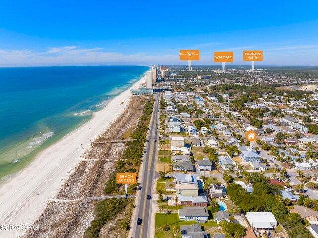 bird's eye view featuring a water view and a beach view