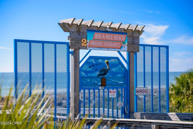 community sign with a water view