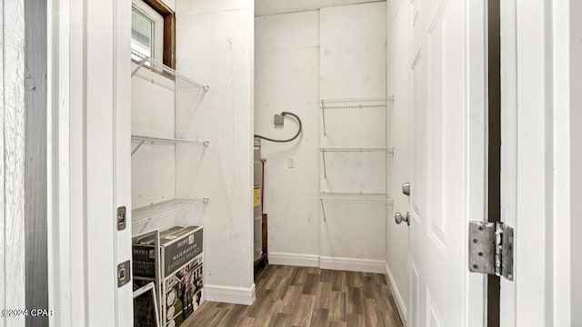 spacious closet featuring hardwood / wood-style flooring