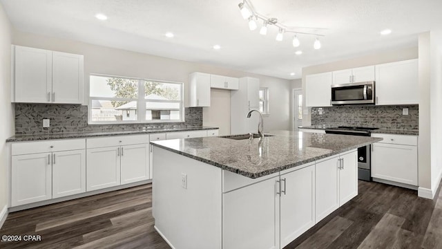 kitchen with white cabinetry, sink, and stainless steel appliances