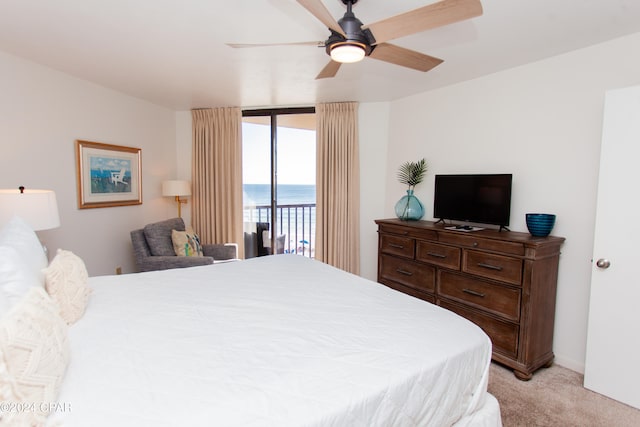 carpeted bedroom featuring access to exterior and ceiling fan