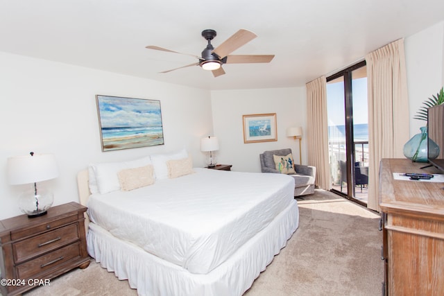 bedroom with ceiling fan, access to outside, and light colored carpet