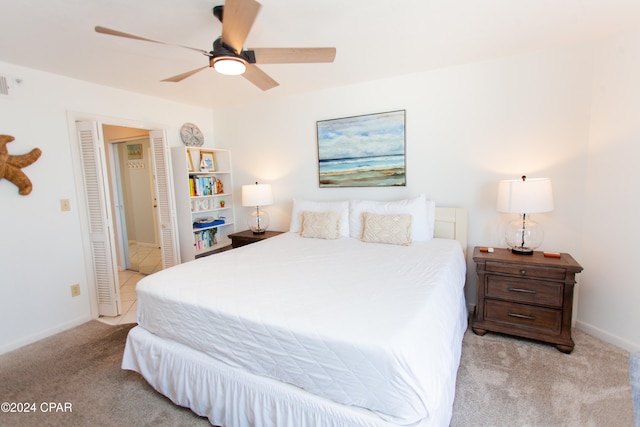 bedroom with light colored carpet and ceiling fan