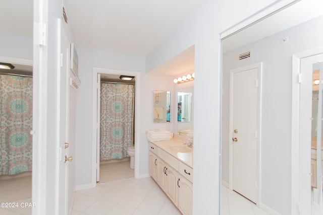 bathroom featuring vanity, toilet, and a shower with curtain