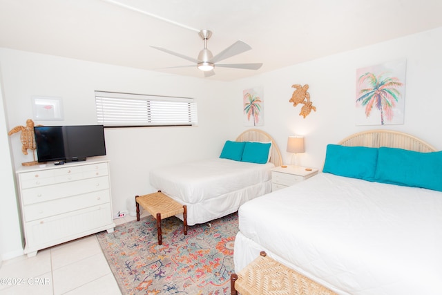 bedroom featuring ceiling fan and light tile patterned flooring