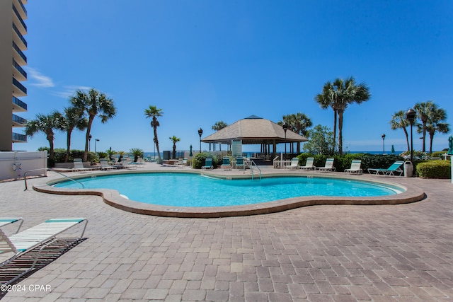 view of pool with a patio and a gazebo