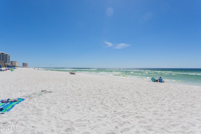 property view of water featuring a beach view