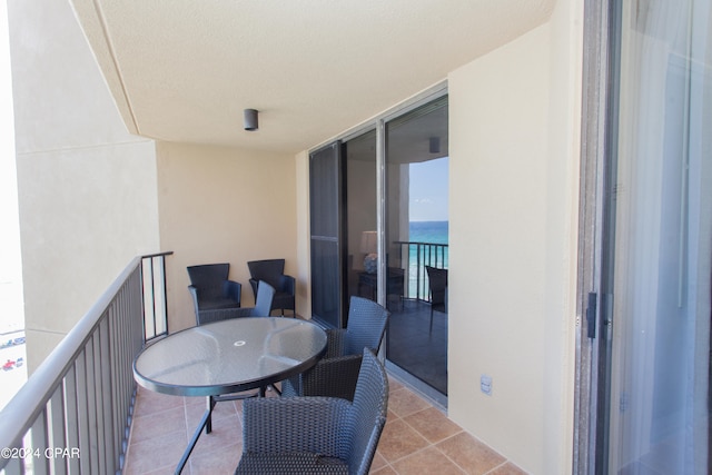 balcony featuring a water view