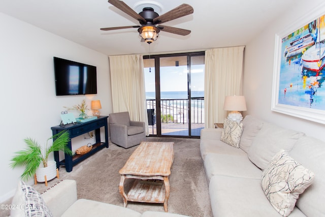 living room featuring carpet floors and ceiling fan