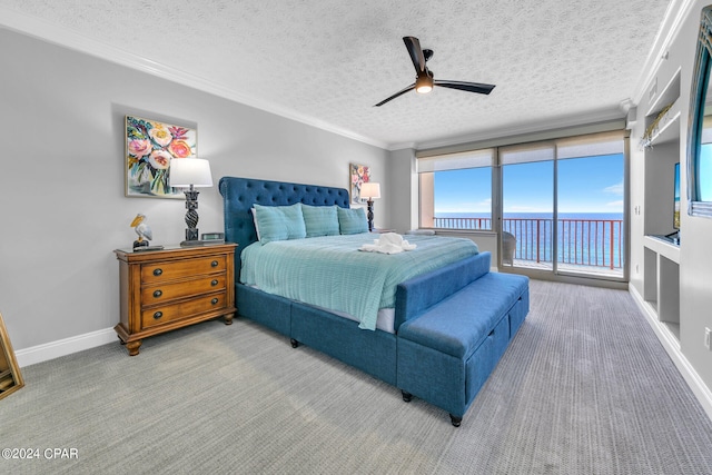 bedroom with carpet and a textured ceiling