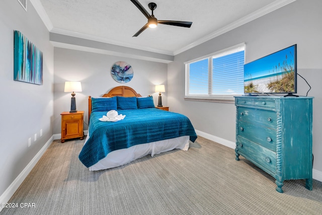 bedroom featuring crown molding, a textured ceiling, carpet floors, and ceiling fan