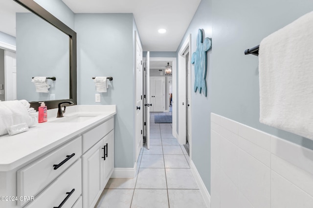 bathroom with tile floors and vanity with extensive cabinet space