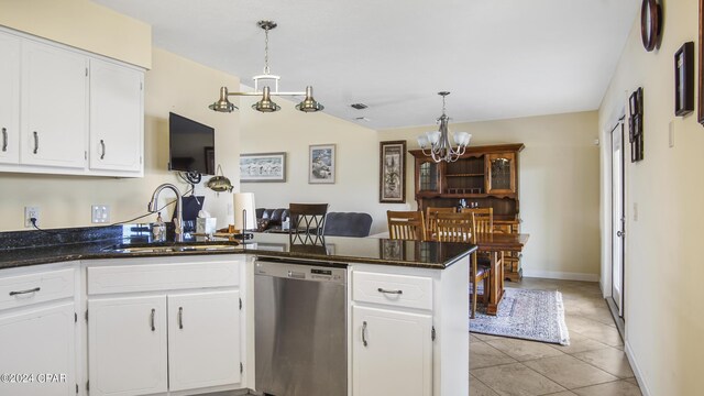 kitchen with an inviting chandelier, decorative light fixtures, dishwasher, sink, and white cabinetry