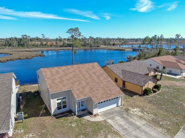 drone / aerial view with a water view