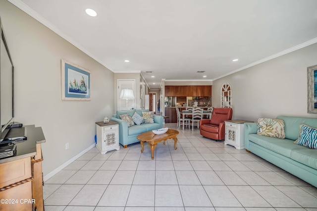 living room featuring ornamental molding and light tile patterned floors