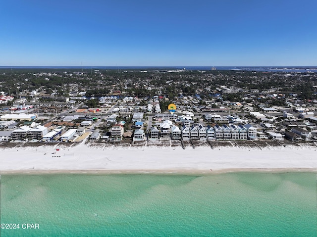 bird's eye view with a water view and a beach view