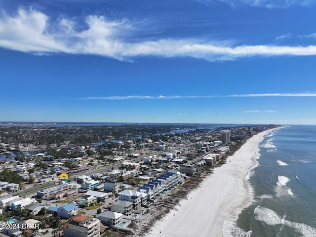 bird's eye view with a water view and a beach view