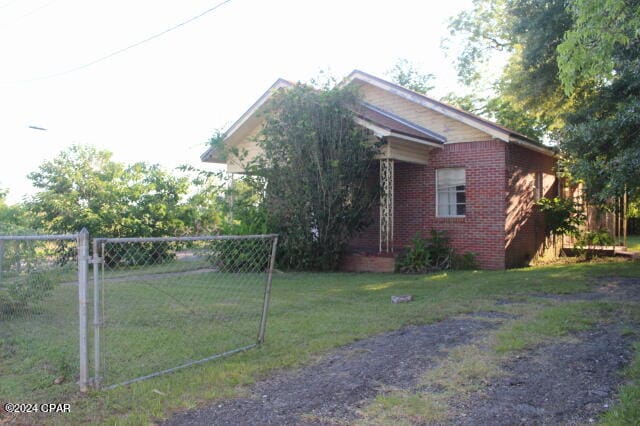 view of home's exterior featuring a yard