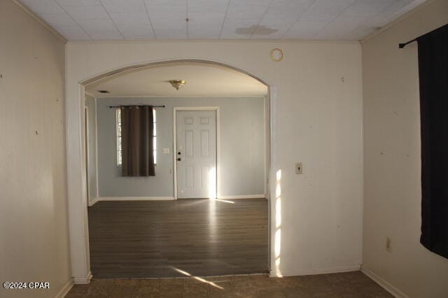 unfurnished room with wood-type flooring