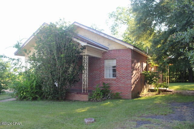 view of home's exterior featuring a lawn