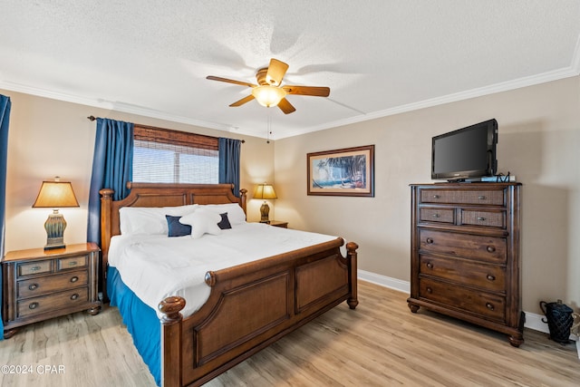 bedroom with a textured ceiling, light hardwood / wood-style floors, ceiling fan, and ornamental molding