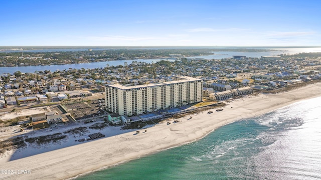 birds eye view of property with a beach view and a water view