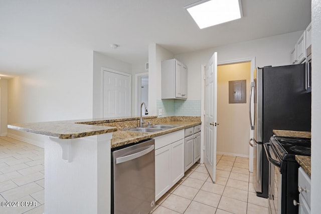 kitchen with light tile flooring, white cabinets, black electric range, dishwasher, and sink