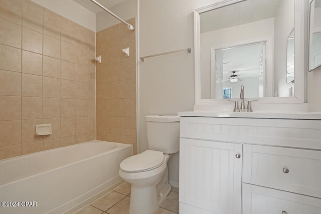 full bathroom with vanity, ceiling fan, tiled shower / bath, tile flooring, and toilet