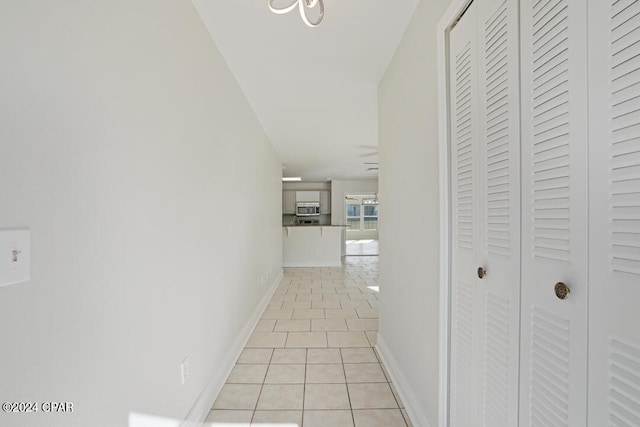 hall with light tile flooring