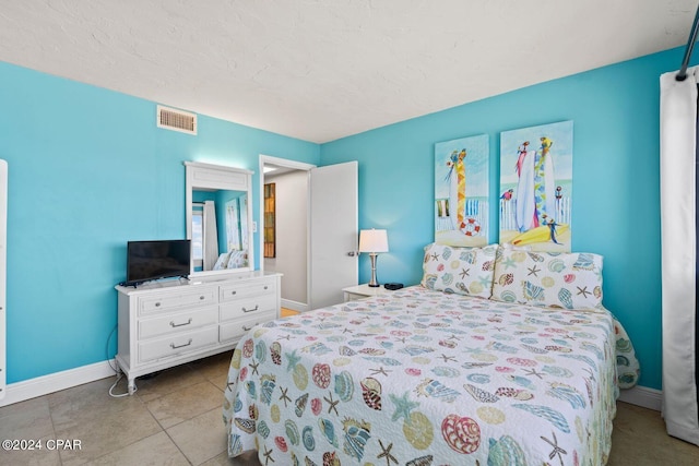 bedroom with tile floors