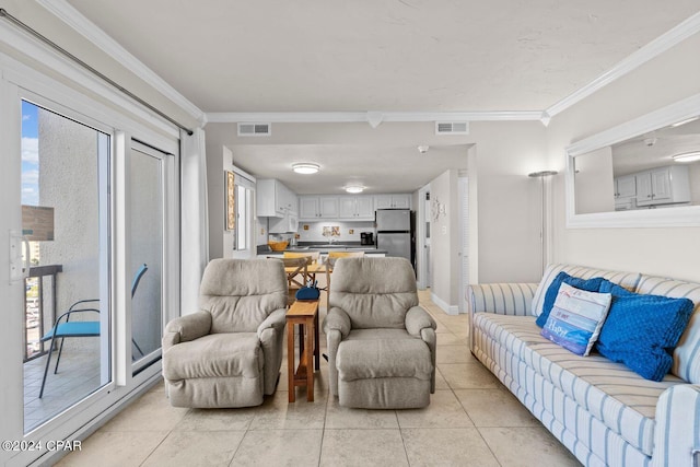 tiled living room featuring ornamental molding and plenty of natural light