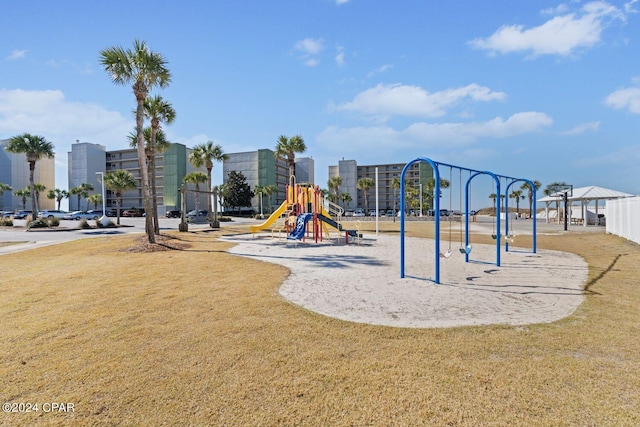 view of playground featuring a lawn