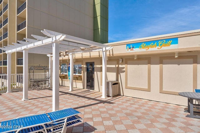 view of patio featuring a pergola