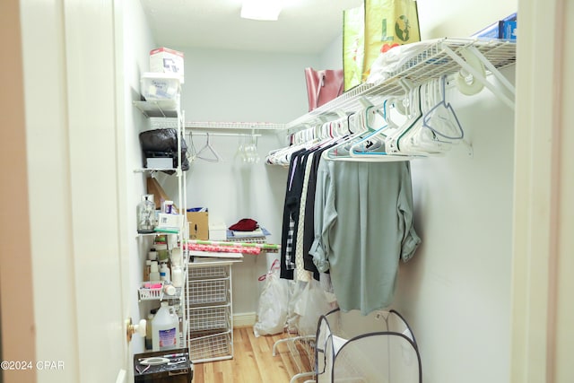 walk in closet featuring hardwood / wood-style flooring