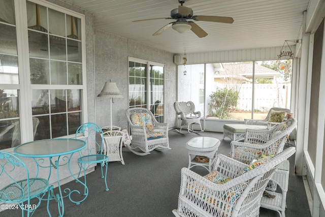 sunroom / solarium with a wealth of natural light and ceiling fan